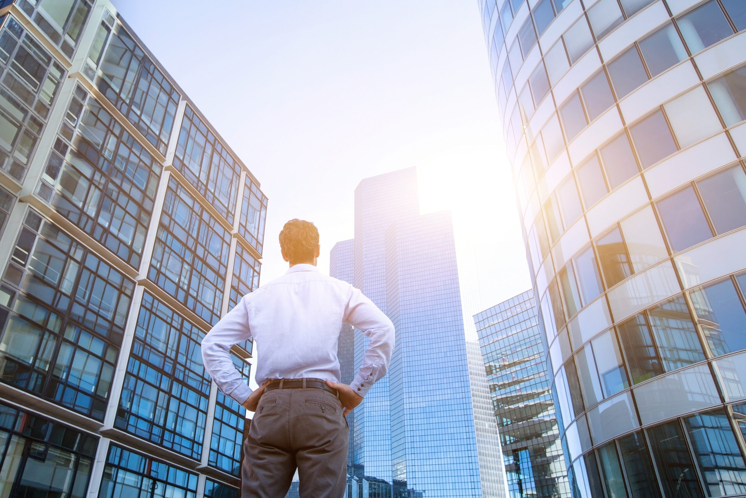 Career,Concept,,Business,Background,,Man,Looking,At,Office,Buildings